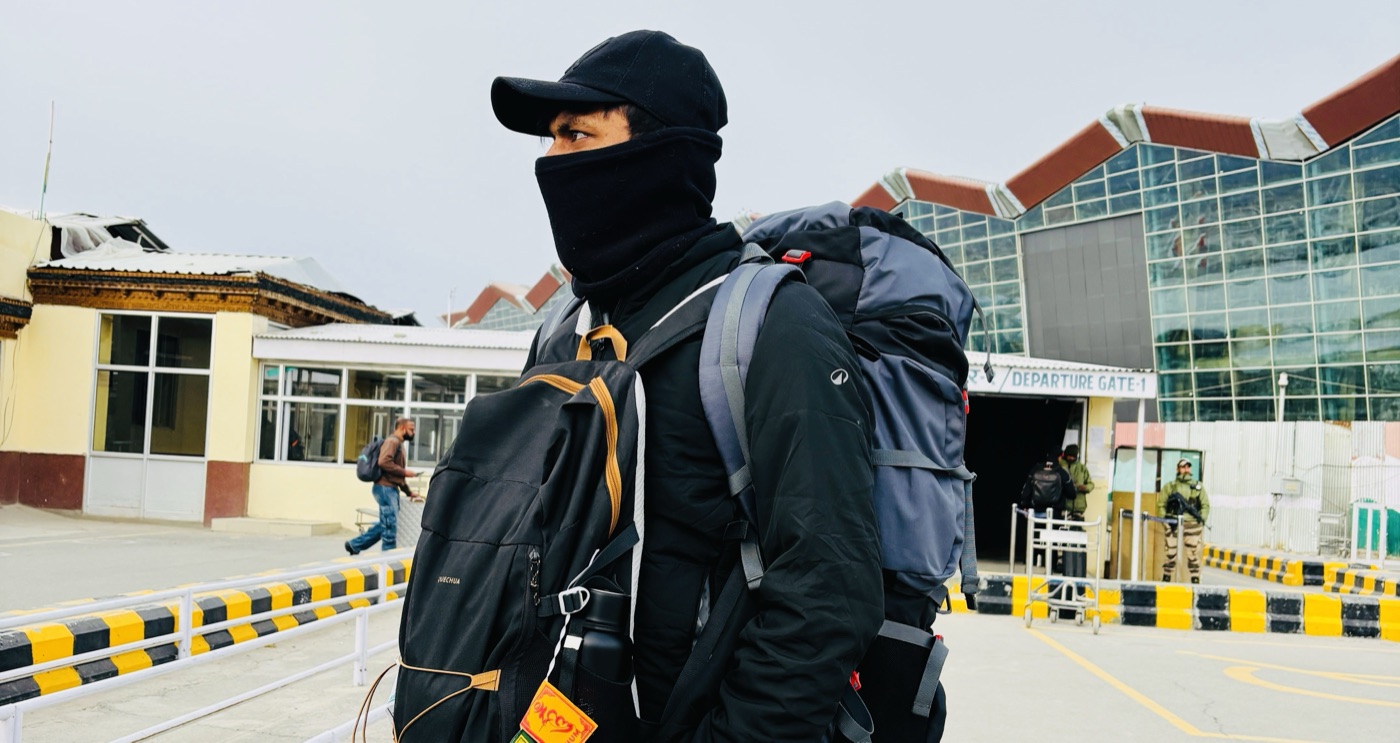 Pratik geared up with expedition backpacks at Leh airport's departure gate